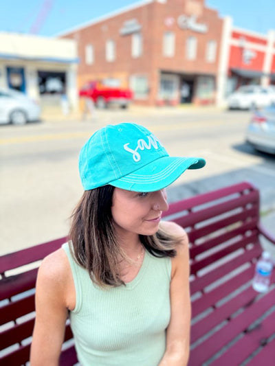 White Saved Embroidery on Turquoise Hat