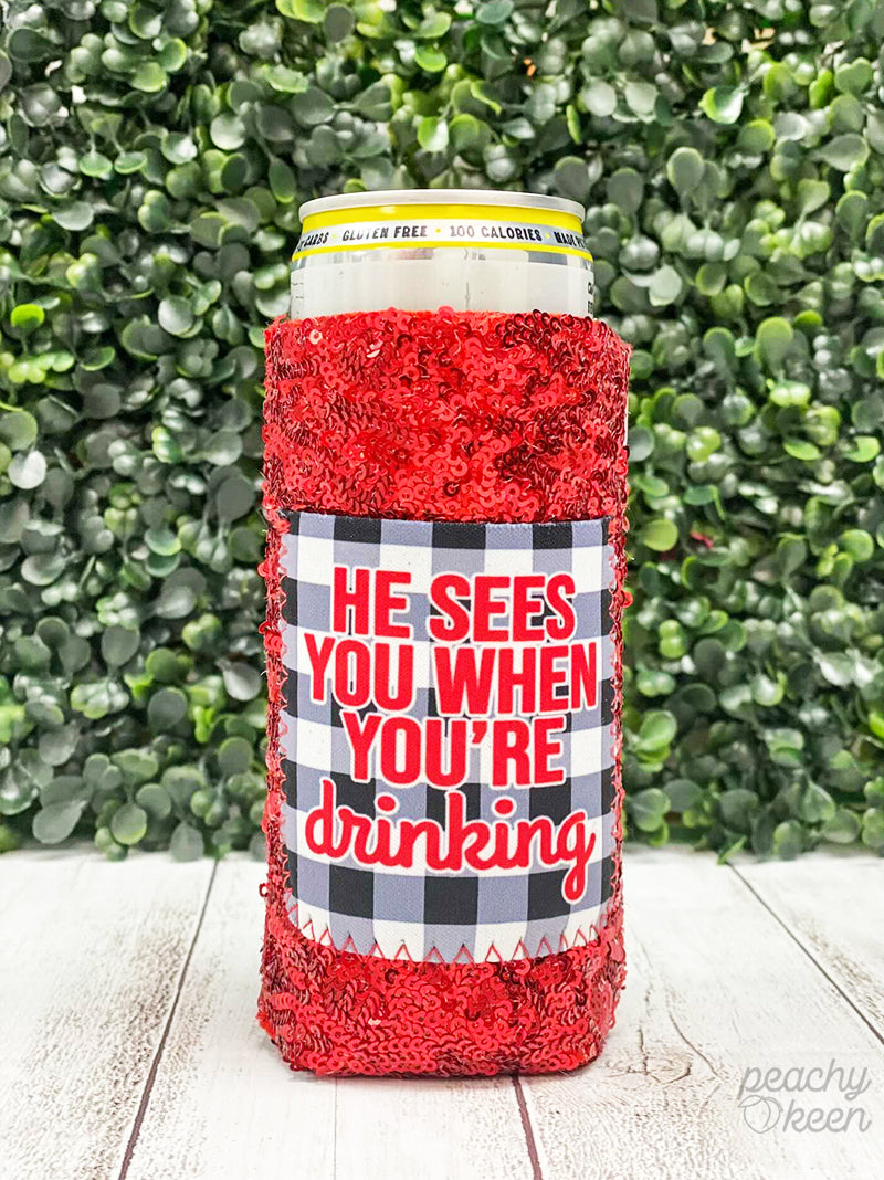 He Sees you when you're Drinking Sequin Slim Can Cooler