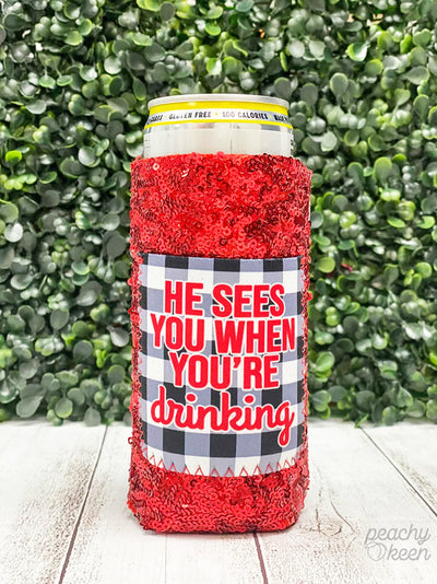 He Sees you when you're Drinking Sequin Slim Can Cooler